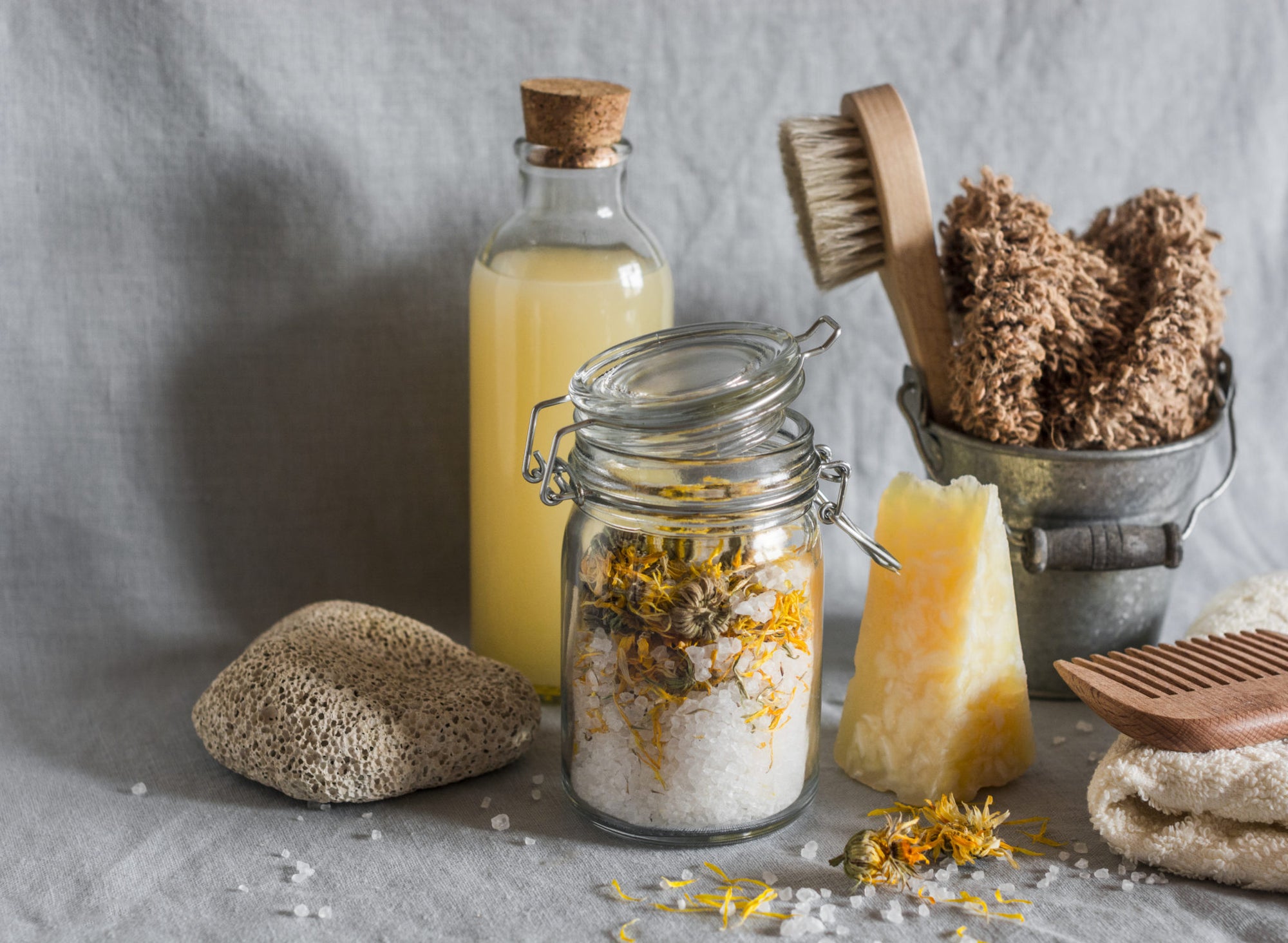Handmade goat milk soap with pure essential oils, organic plant-based oils, and locally farmed botanicals with natural bath tools