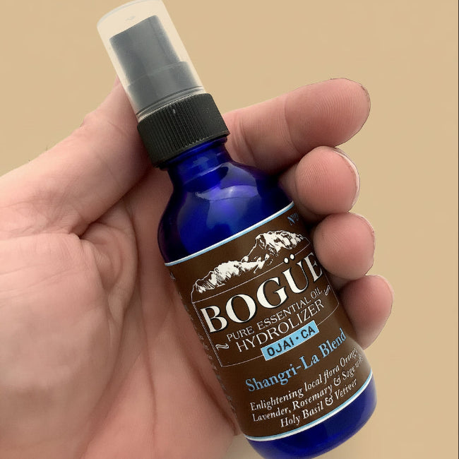 Lavender essential oil spray in hand 2oz size