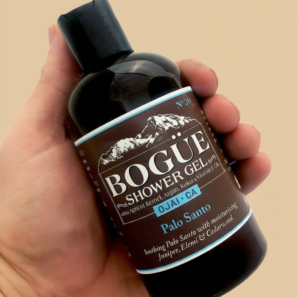 Palo Santo organic shower gel with added oils in hand for size