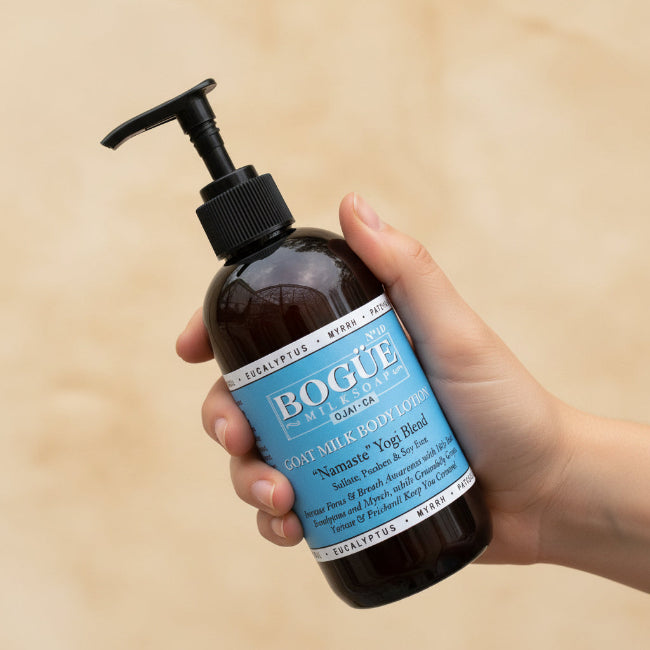 yoga goat milk lotion with eucalyptus ginger vetiver in hand 8oz size