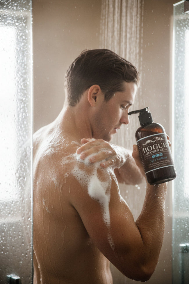 cedarwood shower gel bottle in hand