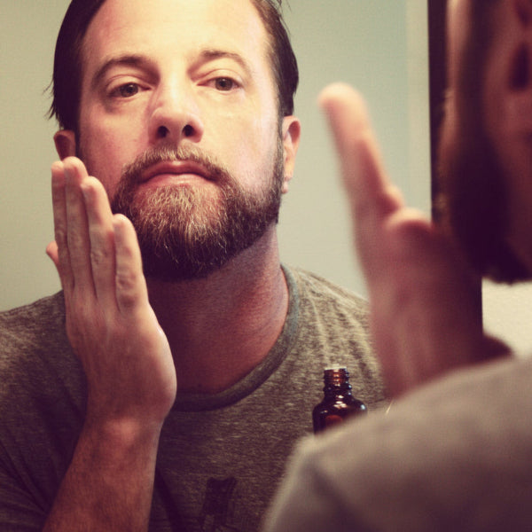 using Cedarwood Beard Balm in the mirror