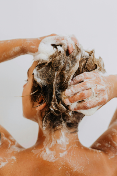 women showing with organic shampoo 